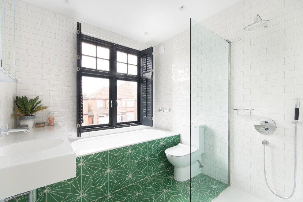 Design ideas for a contemporary master bathroom in London with flat-panel cabinets, a drop-in tub, an alcove shower, a two-piece toilet, white tile, subway tile, white walls, mosaic tile floors, an integrated sink, green floor and an open shower.