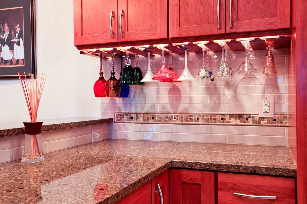 Example of a transitional kitchen design in Seattle with white backsplash and ceramic backsplash