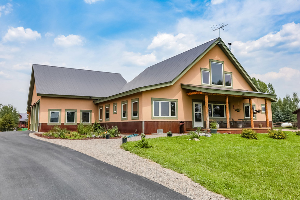 Example of a mountain style home design design in Denver