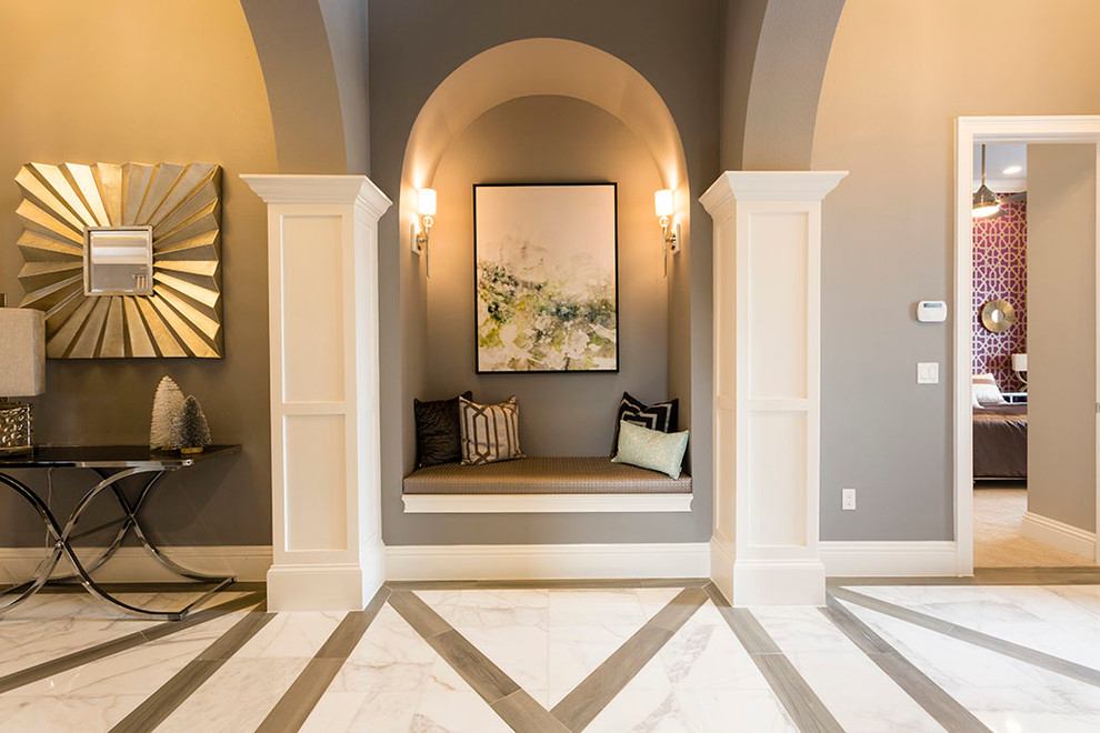Photo of a mid-sized transitional foyer in Orlando with grey walls, porcelain floors and a double front door.