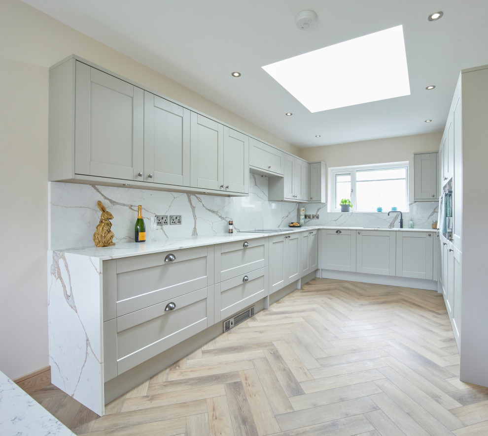 This is an example of a mid-sized modern u-shaped eat-in kitchen in Other with shaker cabinets, grey cabinets, quartzite benchtops, multi-coloured splashback, engineered quartz splashback, no island and multi-coloured benchtop.