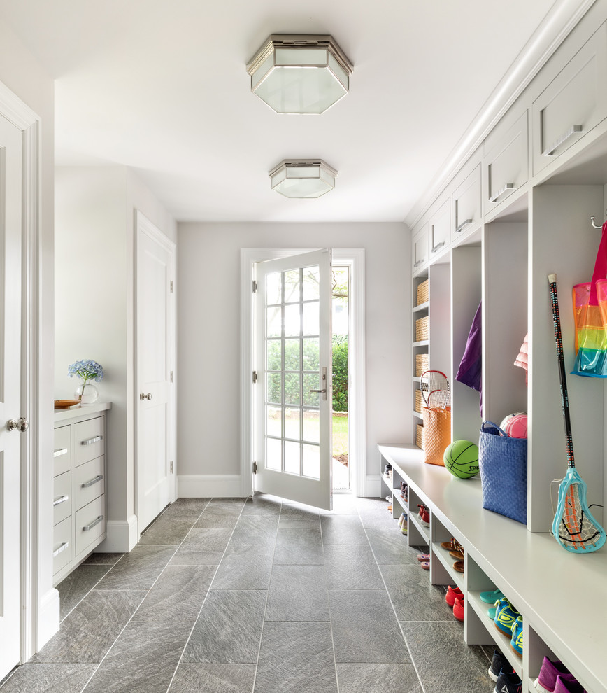 Transitional mudroom in New York with grey walls, a single front door, a glass front door and grey floor.