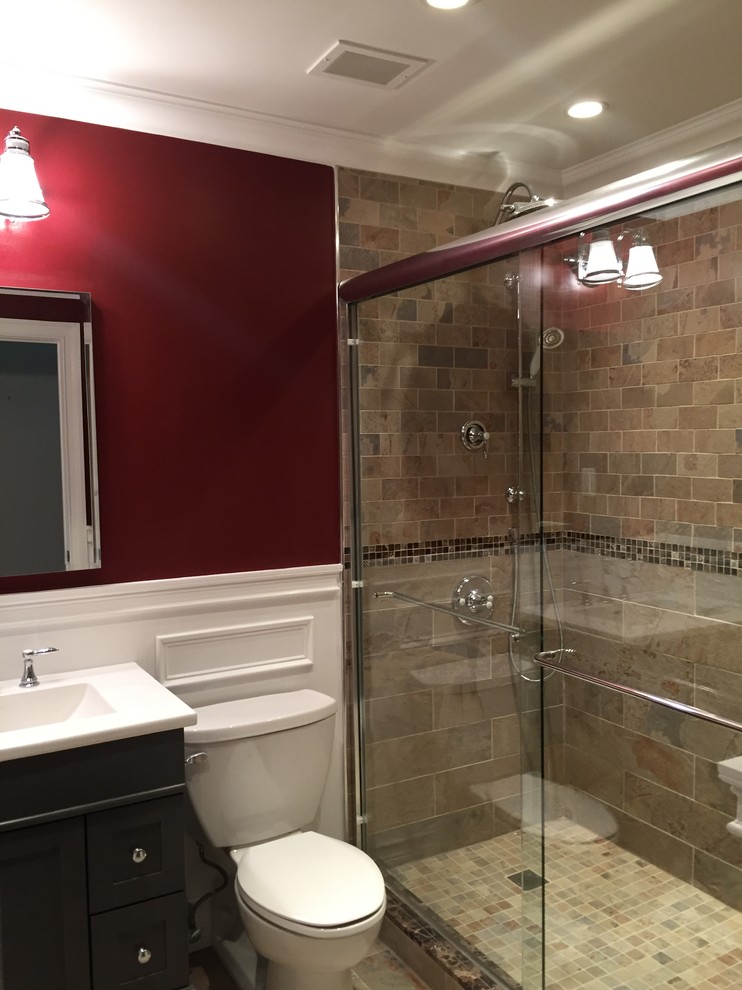 Design ideas for a mid-sized traditional master bathroom in New York with furniture-like cabinets, grey cabinets, an open shower, a wall-mount toilet, beige tile, porcelain tile, red walls, porcelain floors, an integrated sink, quartzite benchtops, beige floor and a sliding shower screen.