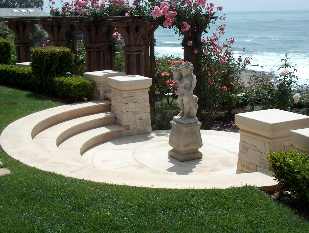 Design ideas for a large backyard full sun garden in San Diego with natural stone pavers.