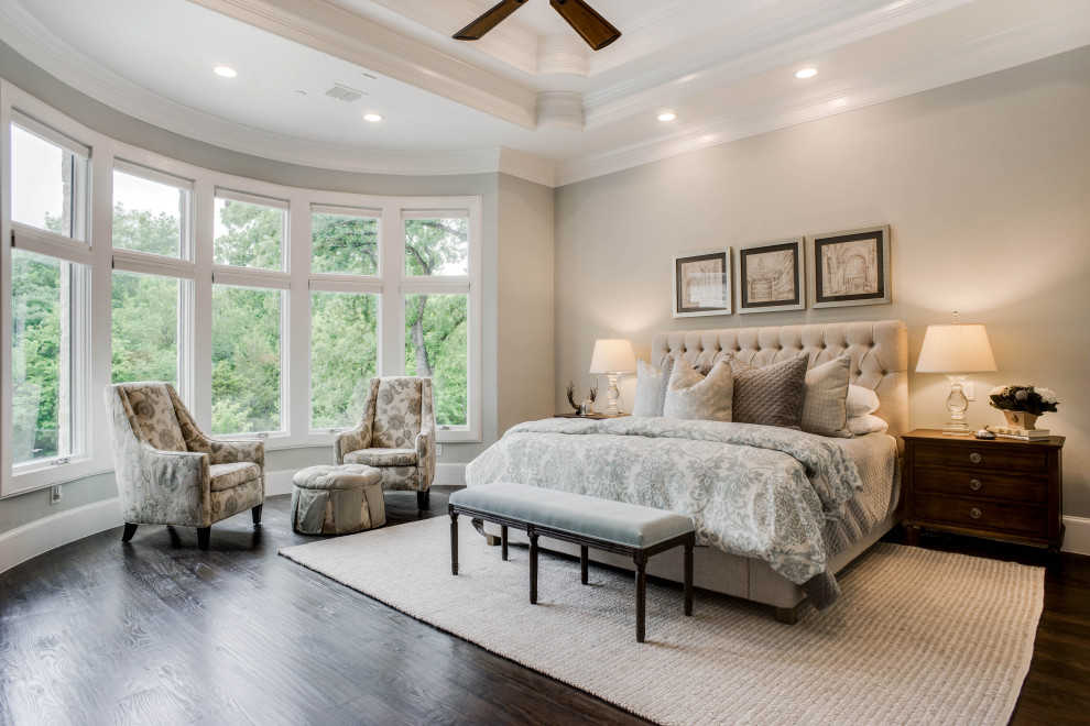This is an example of a transitional bedroom in Dallas.