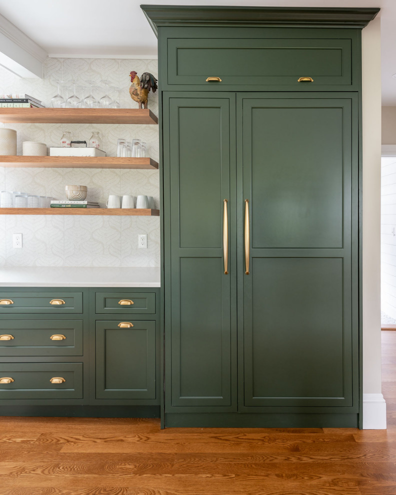 Eat-in kitchen - huge transitional medium tone wood floor and brown floor eat-in kitchen idea in Boston with a farmhouse sink, shaker cabinets, green cabinets, quartz countertops, beige backsplash, an island and white countertops