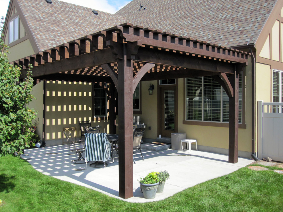 Example of a patio design in Salt Lake City with a pergola