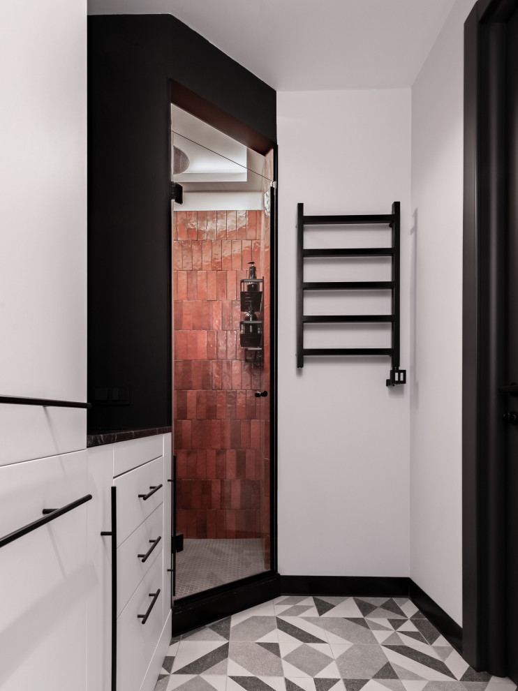 Design ideas for a mid-sized 3/4 wet room bathroom in Moscow with flat-panel cabinets, white cabinets, a wall-mount toilet, red tile, ceramic tile, grey walls, an undermount sink, granite benchtops, a hinged shower door, black benchtops, a single vanity and a built-in vanity.