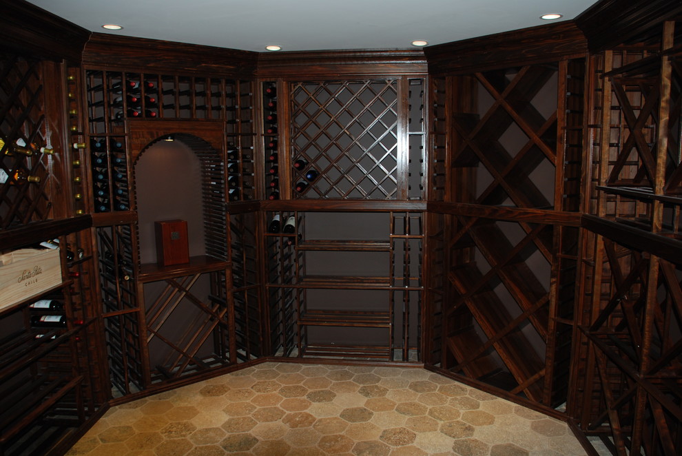 Photo of a mid-sized traditional wine cellar in New York with diamond bins.