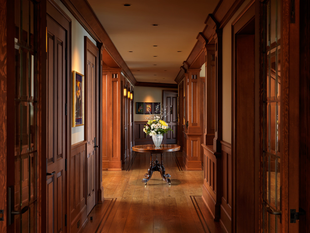 Inspiration for a traditional hallway in Vancouver with dark hardwood floors.