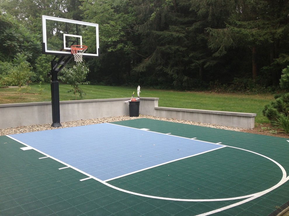 This is an example of a large traditional backyard partial sun outdoor sport court in Boston.