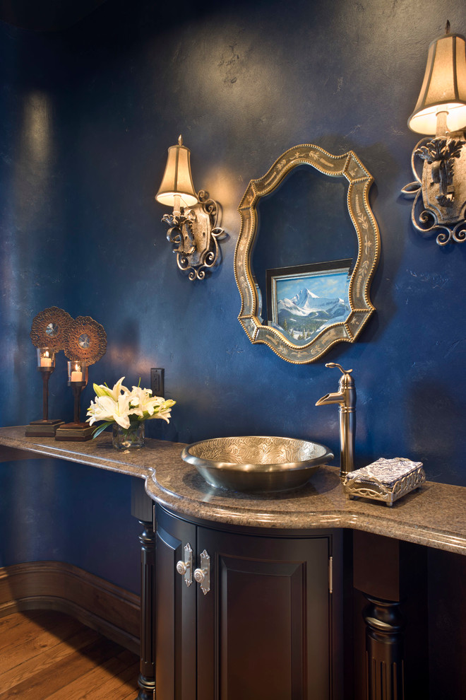 Inspiration for a traditional powder room in Other with a vessel sink.