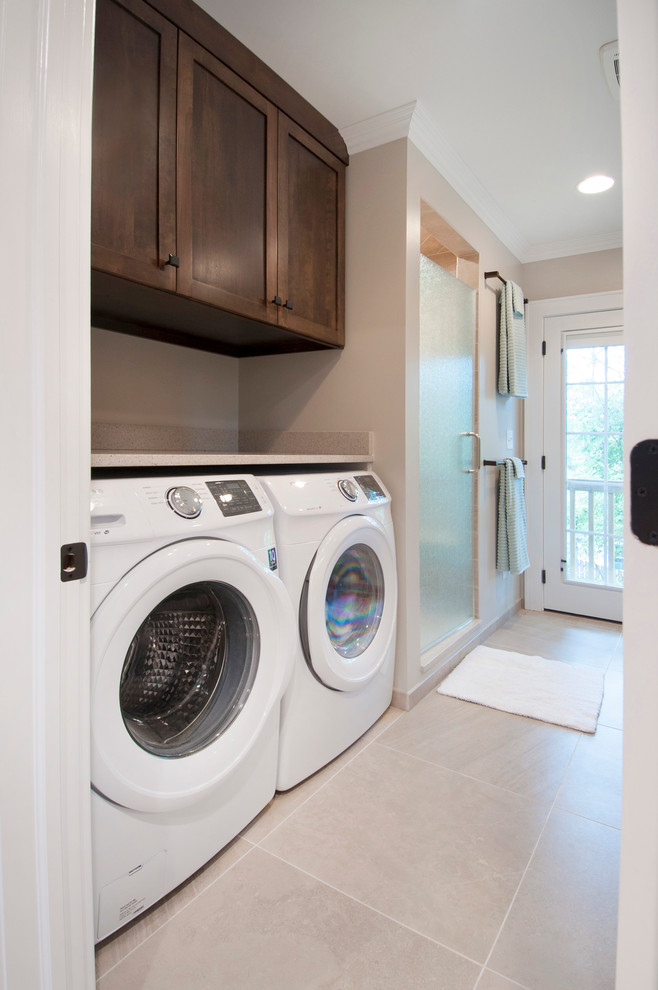 Inspiration for a mid-sized modern laundry room in Columbus with shaker cabinets, medium wood cabinets, beige walls and porcelain floors.