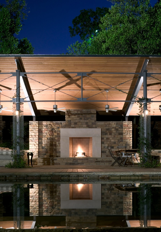 This is an example of a contemporary patio in Dallas with a fire feature.