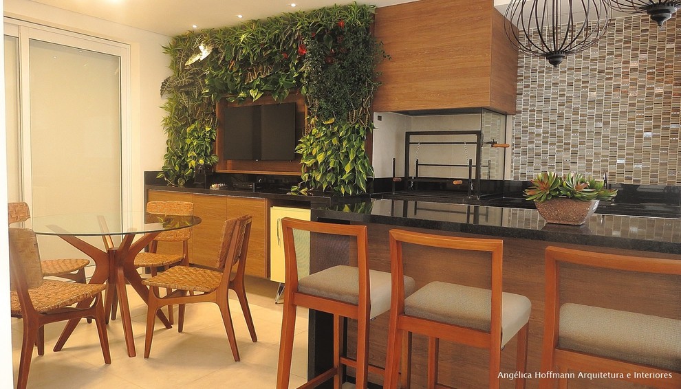Outdoor kitchen deck - large contemporary side yard outdoor kitchen deck idea with a roof extension