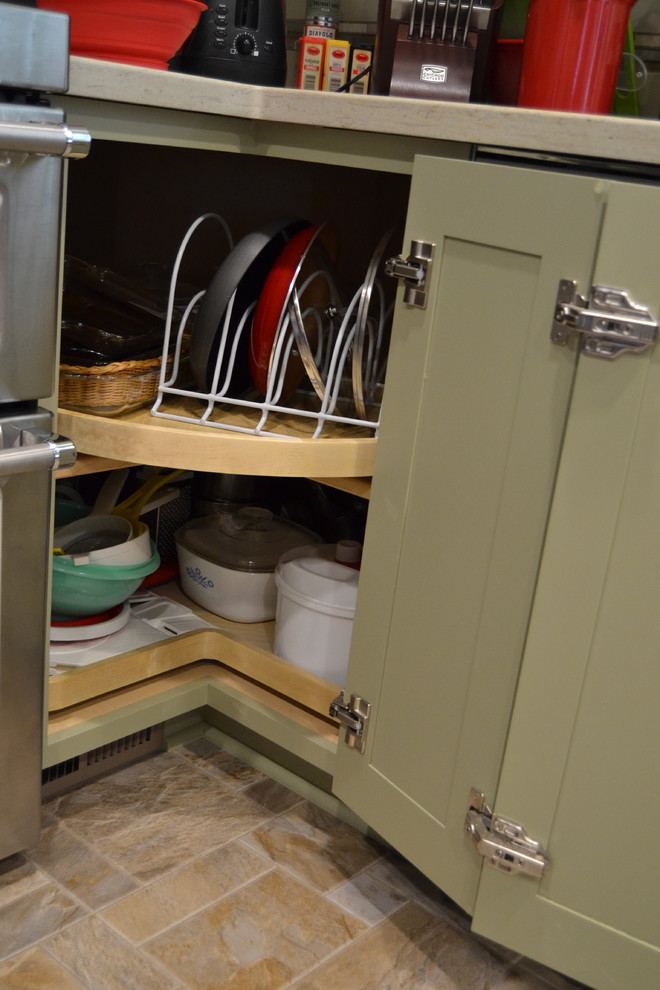 Eat-in kitchen - mid-sized transitional l-shaped ceramic tile and beige floor eat-in kitchen idea with shaker cabinets, green cabinets, stainless steel appliances and no island