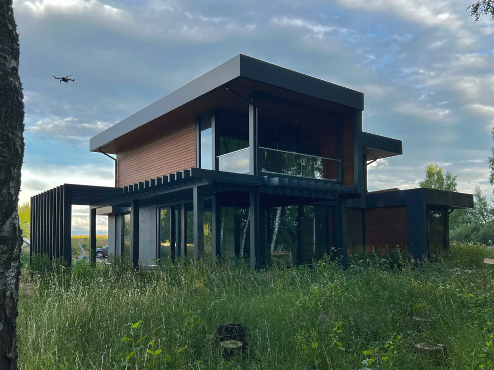 Двухэтажный дом с плоской кровлей и панорамным остеклением Flta'n'Wood 280м²