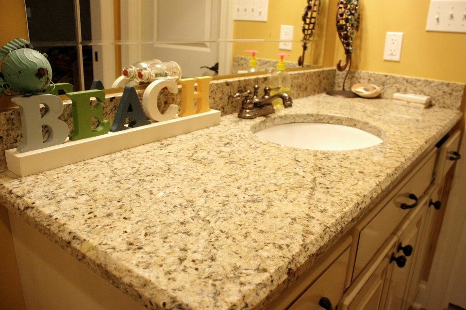 This is an example of a mid-sized traditional kids bathroom in Other with an undermount sink, beige cabinets, granite benchtops, shaker cabinets and yellow walls.