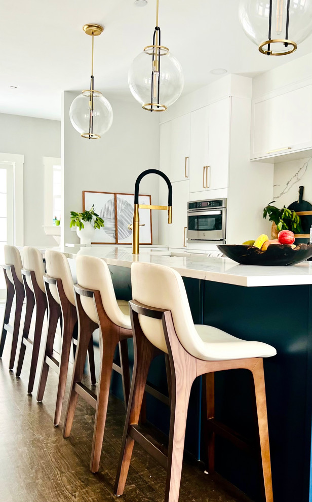 Contemporary kitchen with navy island