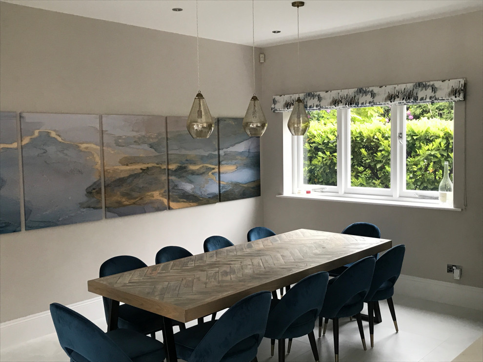 This is an example of a large contemporary kitchen/dining room in Dorset with marble flooring and white floors.