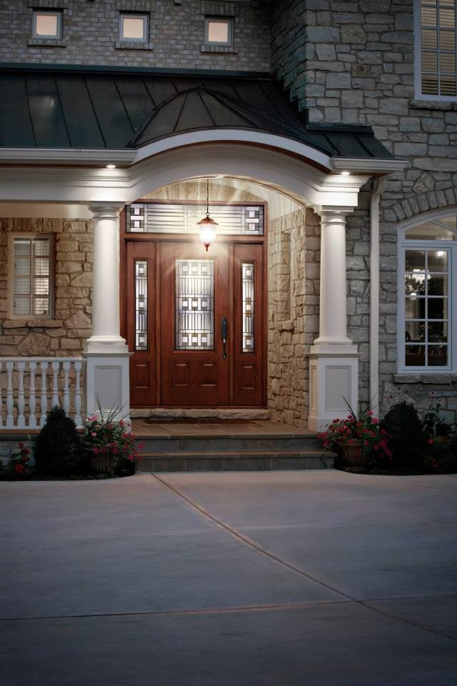 Photo of a large contemporary front door in Raleigh with a single front door and a medium wood front door.
