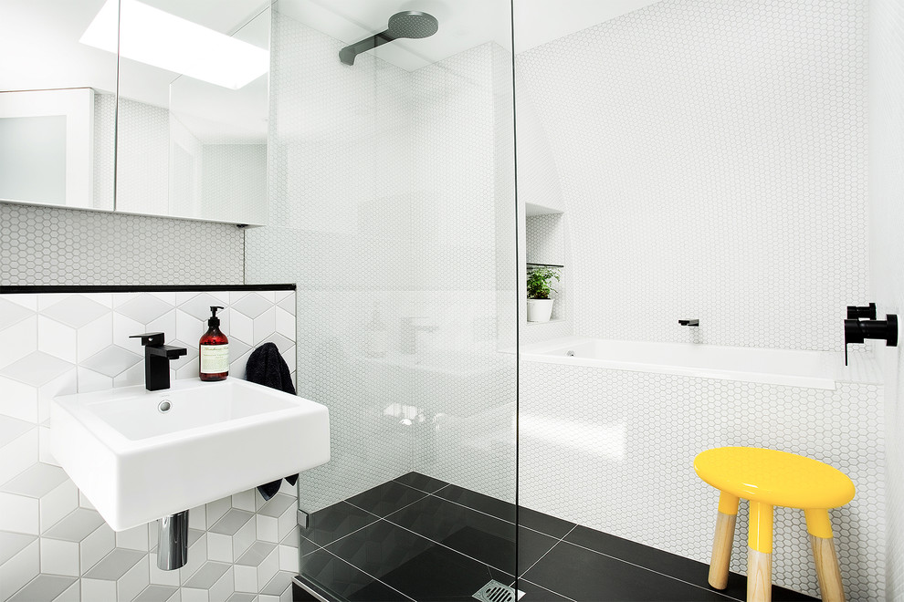 Photo of a contemporary bathroom in Los Angeles with a wall-mount sink, a curbless shower, white tile, mosaic tile, a drop-in tub and black floor.