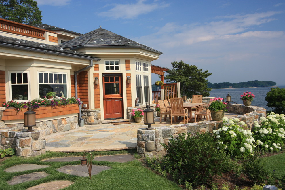 Design ideas for a traditional patio in Bridgeport with natural stone pavers and no cover.