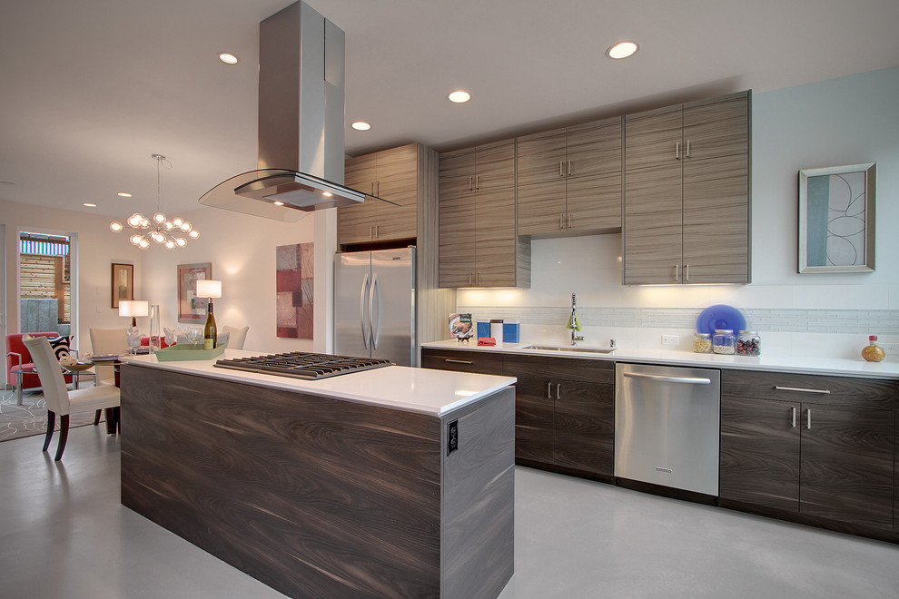 Contemporary galley eat-in kitchen in Seattle with an undermount sink, flat-panel cabinets, grey cabinets and stainless steel appliances.