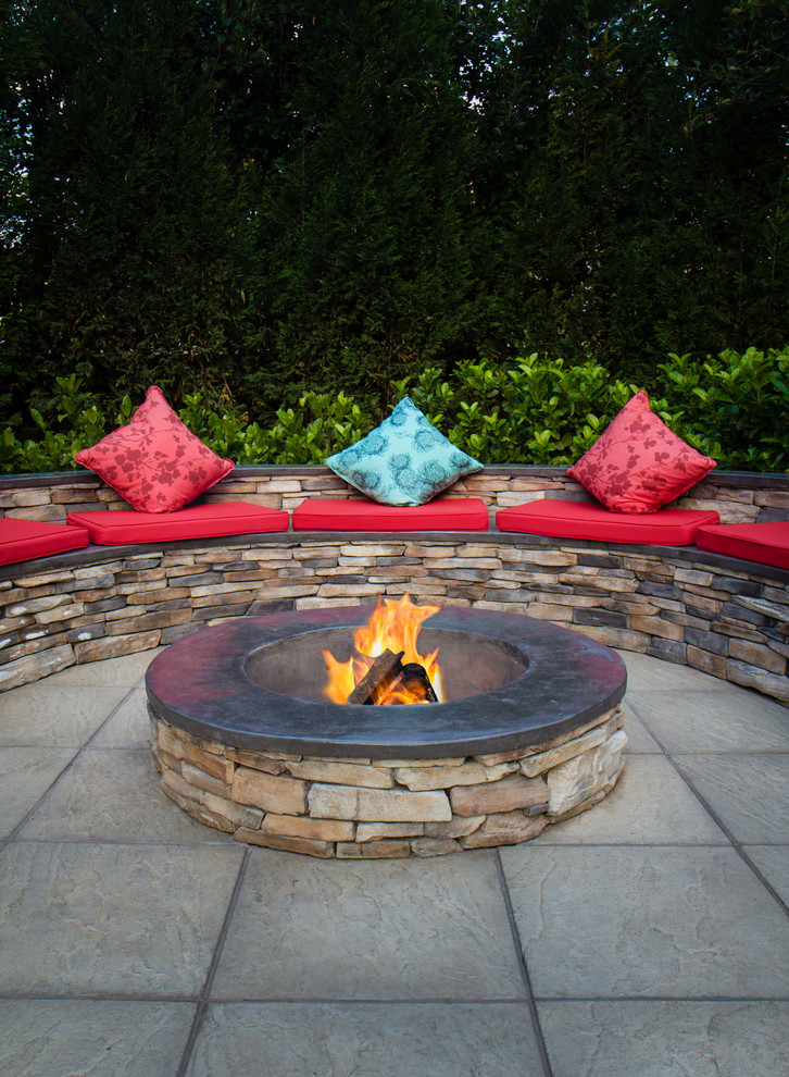 Mountain style backyard concrete paver full sun patio photo