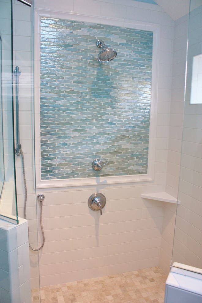 Corner shower - mid-sized transitional 3/4 beige tile, blue tile and mosaic tile ceramic tile corner shower idea with shaker cabinets, white cabinets, a one-piece toilet, blue walls, an undermount sink and solid surface countertops
