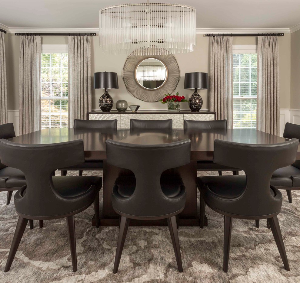 This is an example of a mid-sized transitional separate dining room in Philadelphia with beige walls and carpet.