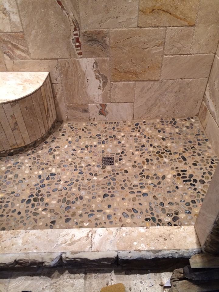 Mid-sized mountain style master stone tile travertine floor alcove shower photo with granite countertops