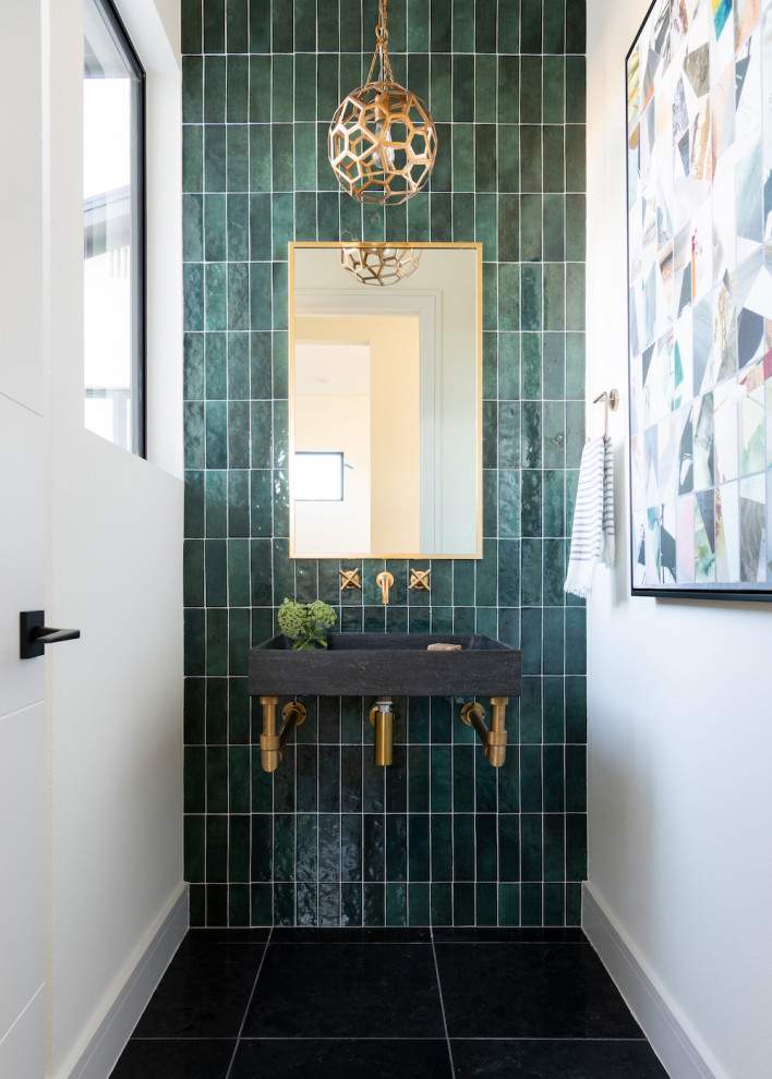 Trendy green tile black floor powder room photo in Dallas with open cabinets, gray cabinets, white walls, a wall-mount sink and a floating vanity