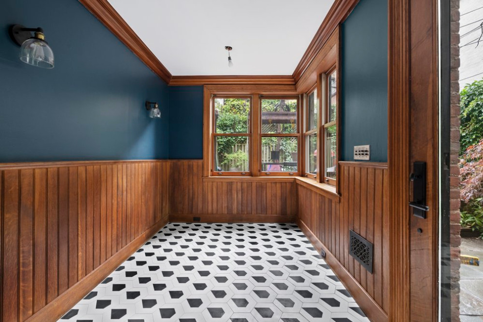Photo of a mid-sized transitional sunroom in New York with ceramic floors and multi-coloured floor.