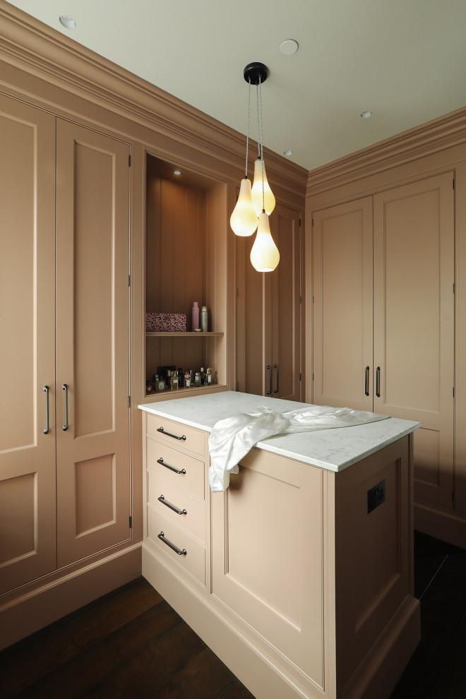 This is an example of a transitional storage and wardrobe in London.