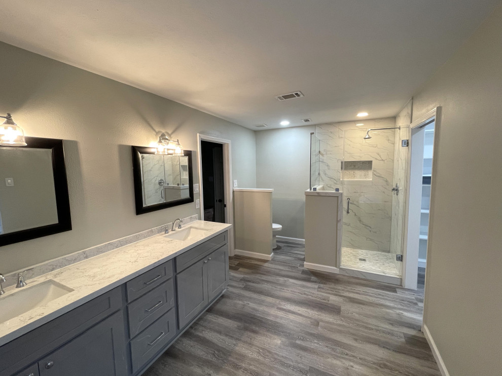 Photo of a large contemporary bathroom in Houston with shaker cabinets, grey cabinets, a freestanding tub, a drop-in sink, engineered quartz benchtops, grey benchtops, a double vanity and a built-in vanity.