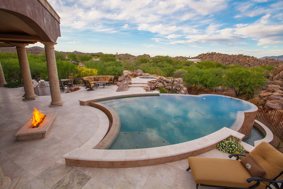 Photo of a mediterranean custom-shaped infinity pool in Phoenix.