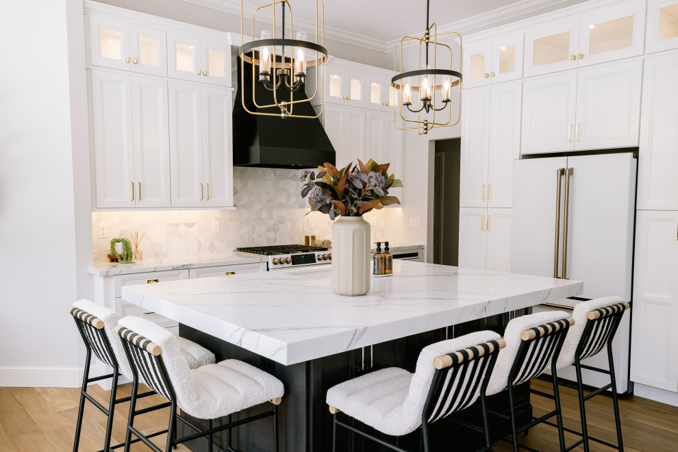 Large transitional u-shaped medium tone wood floor and brown floor eat-in kitchen photo in Orlando with a drop-in sink, beaded inset cabinets, white cabinets, quartz countertops, gray backsplash, marble backsplash, white appliances, an island and white countertops