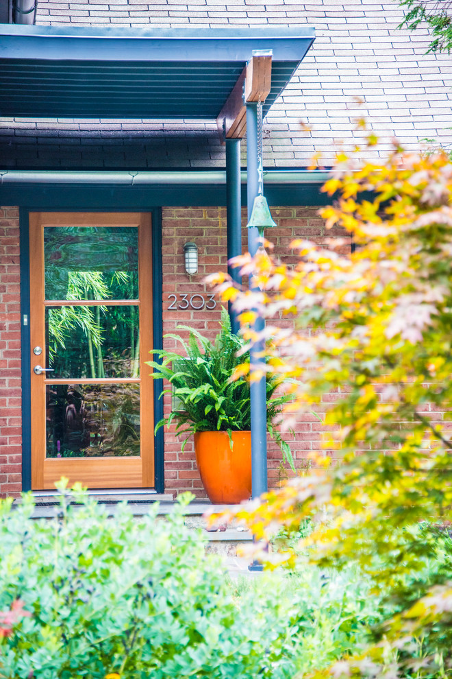 Entryway - mid-sized transitional split-level brick entryway idea in DC Metro
