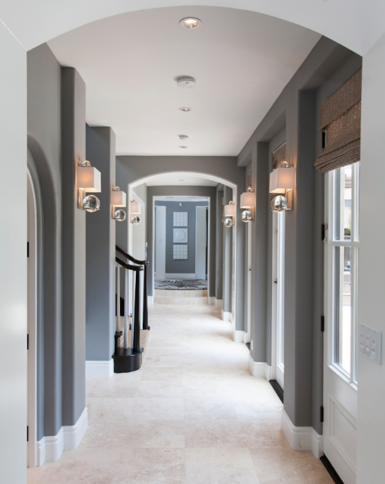 Inspiration for a transitional hallway in Orange County with grey walls and beige floor.