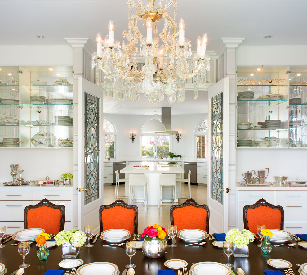 This is an example of an expansive eclectic separate dining room in San Diego with white walls.