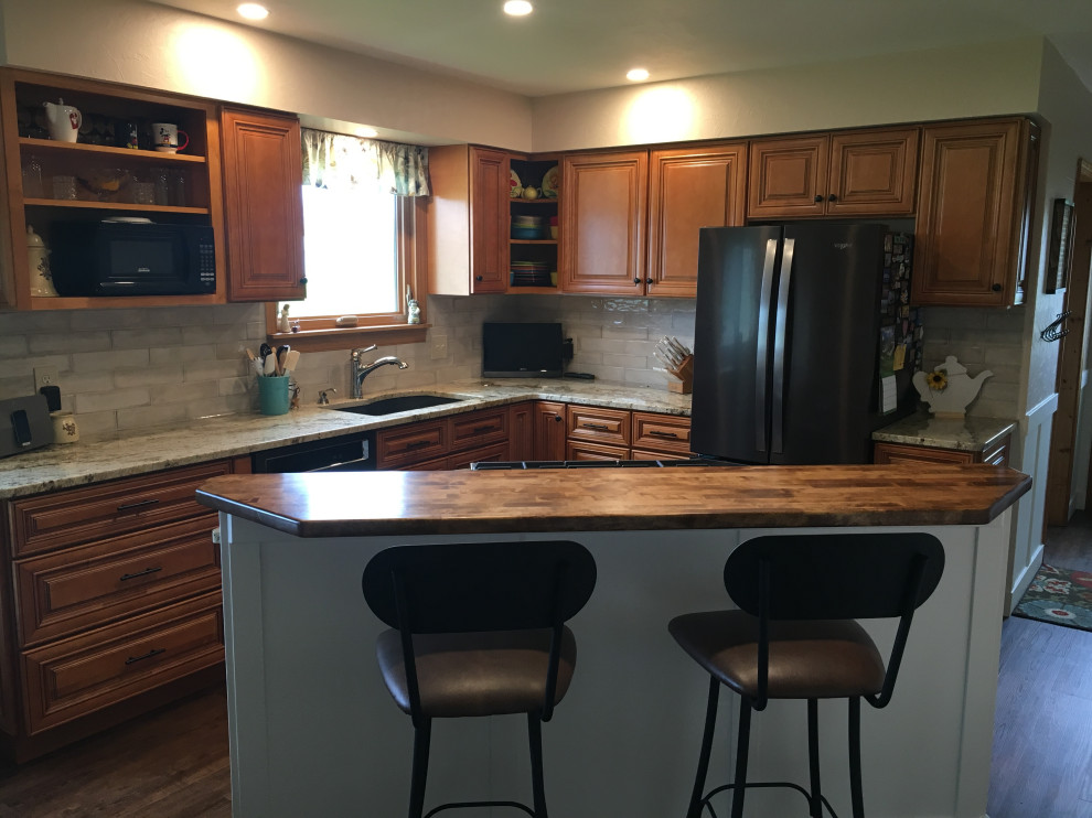 This is an example of a classic kitchen/diner with brown cabinets.
