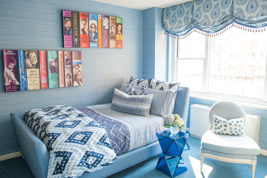 This is an example of a mid-sized contemporary guest bedroom in New York with blue walls, carpet, no fireplace and blue floor.