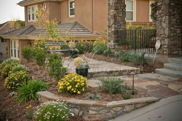 Design ideas for a large front yard xeriscape in San Diego with concrete pavers.