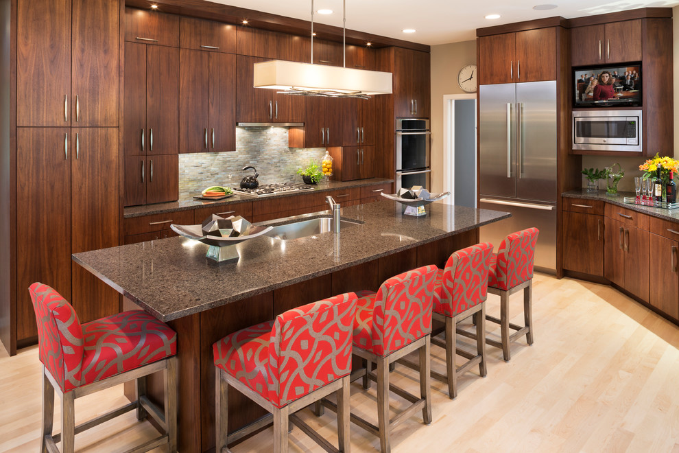 Design ideas for a contemporary kitchen in Minneapolis with an undermount sink, flat-panel cabinets, medium wood cabinets, quartzite benchtops, grey splashback, stone tile splashback, stainless steel appliances, light hardwood floors and with island.