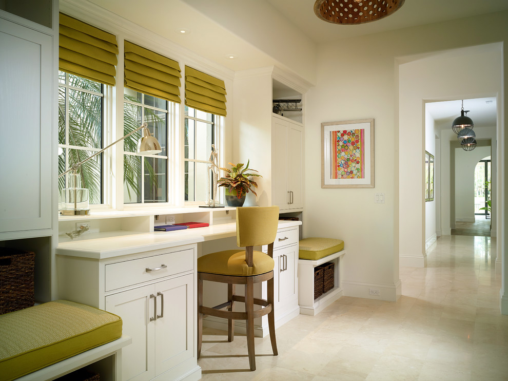 This is an example of a tropical home office in Miami with white walls.