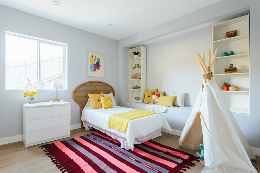 Kids' room - large scandinavian gender-neutral light wood floor and beige floor kids' room idea in Los Angeles with gray walls