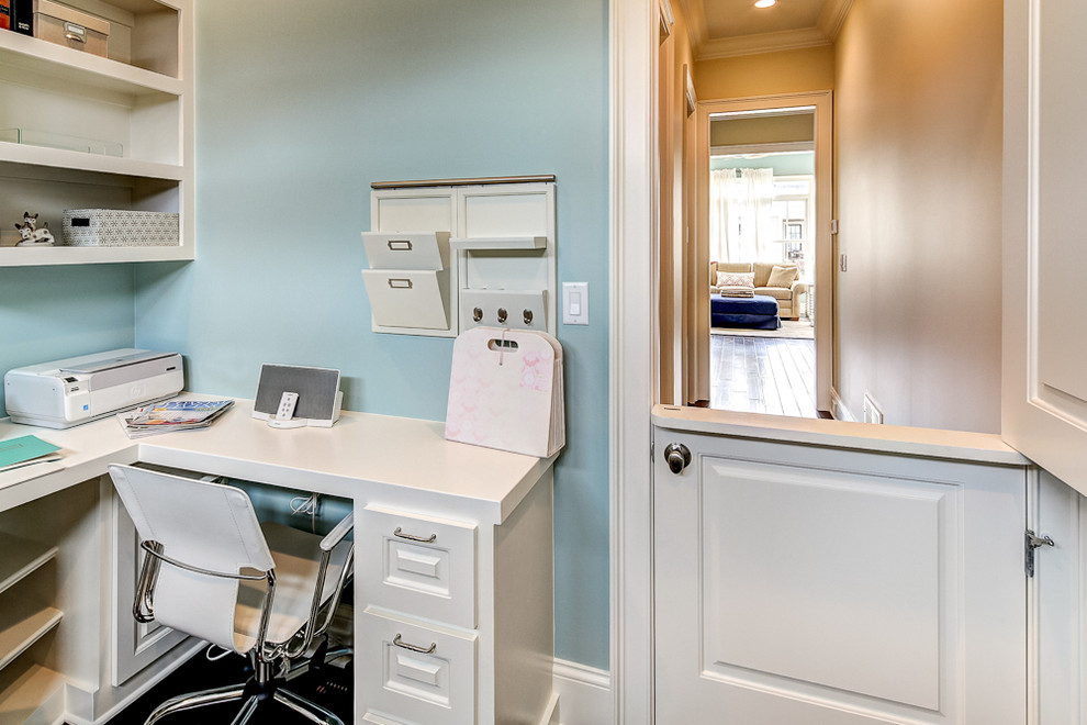 This is an example of a traditional home office in Louisville with blue walls.