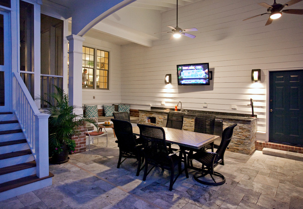 Design ideas for a large traditional backyard patio in Charleston with a roof extension.