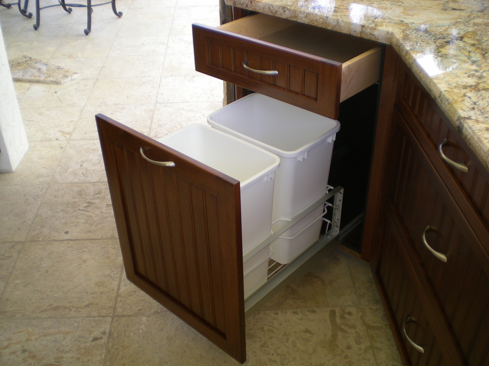This is an example of a mid-sized traditional eat-in kitchen in Miami with shaker cabinets, dark wood cabinets, granite benchtops and cement tiles.